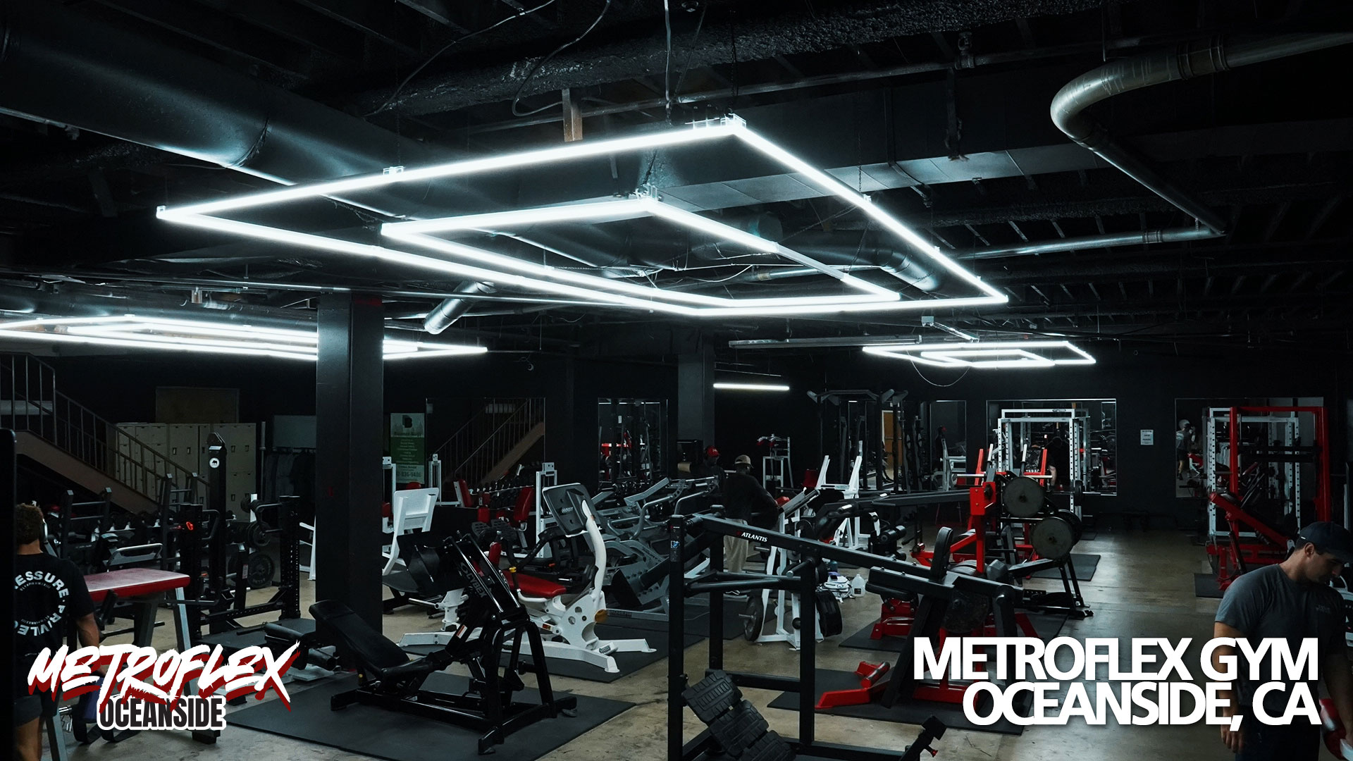 Weight machines and benches across the MetroFlex Oceanside training floor.